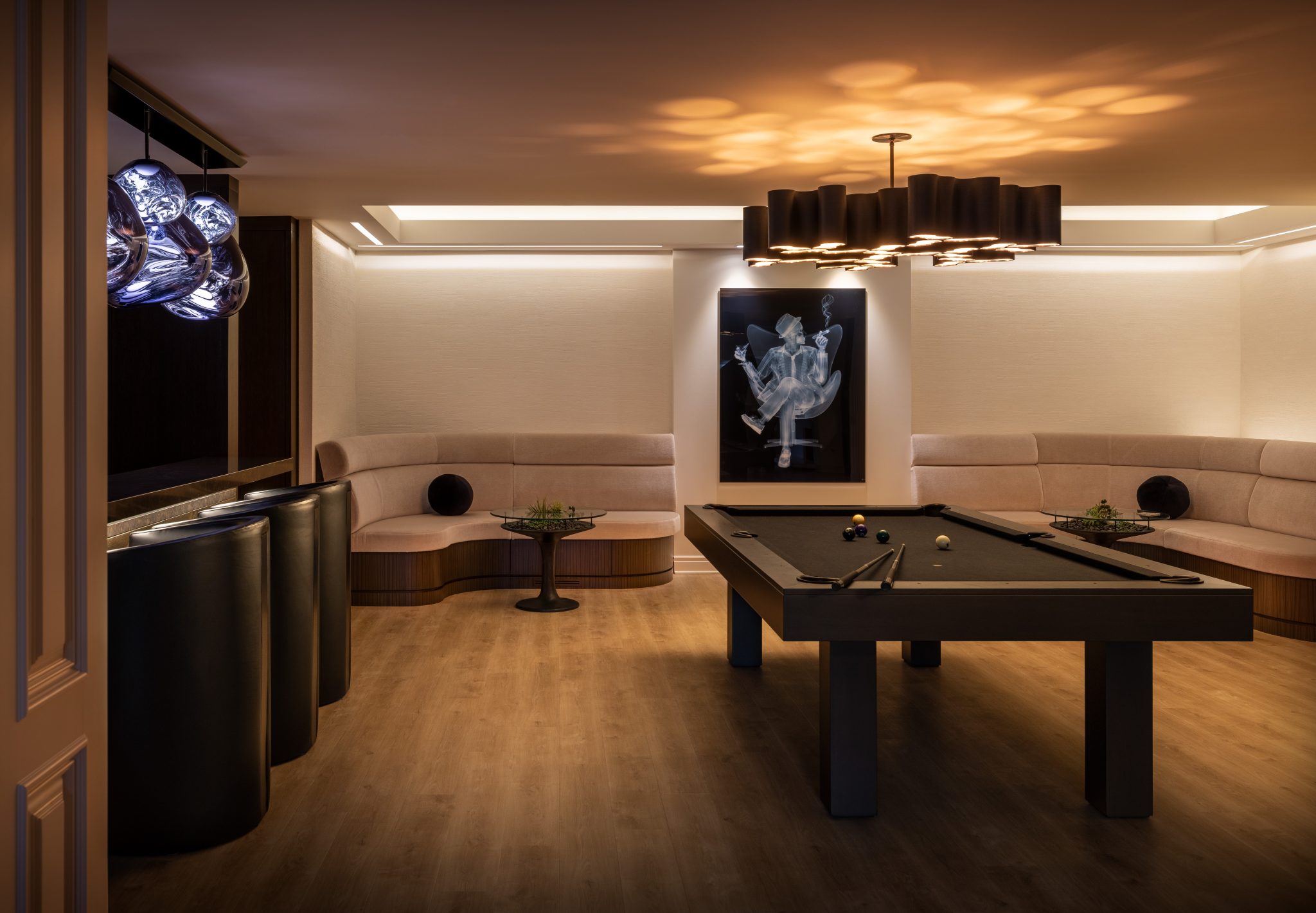 a basement remodeled into a hangout with a kitchen and wine cellar