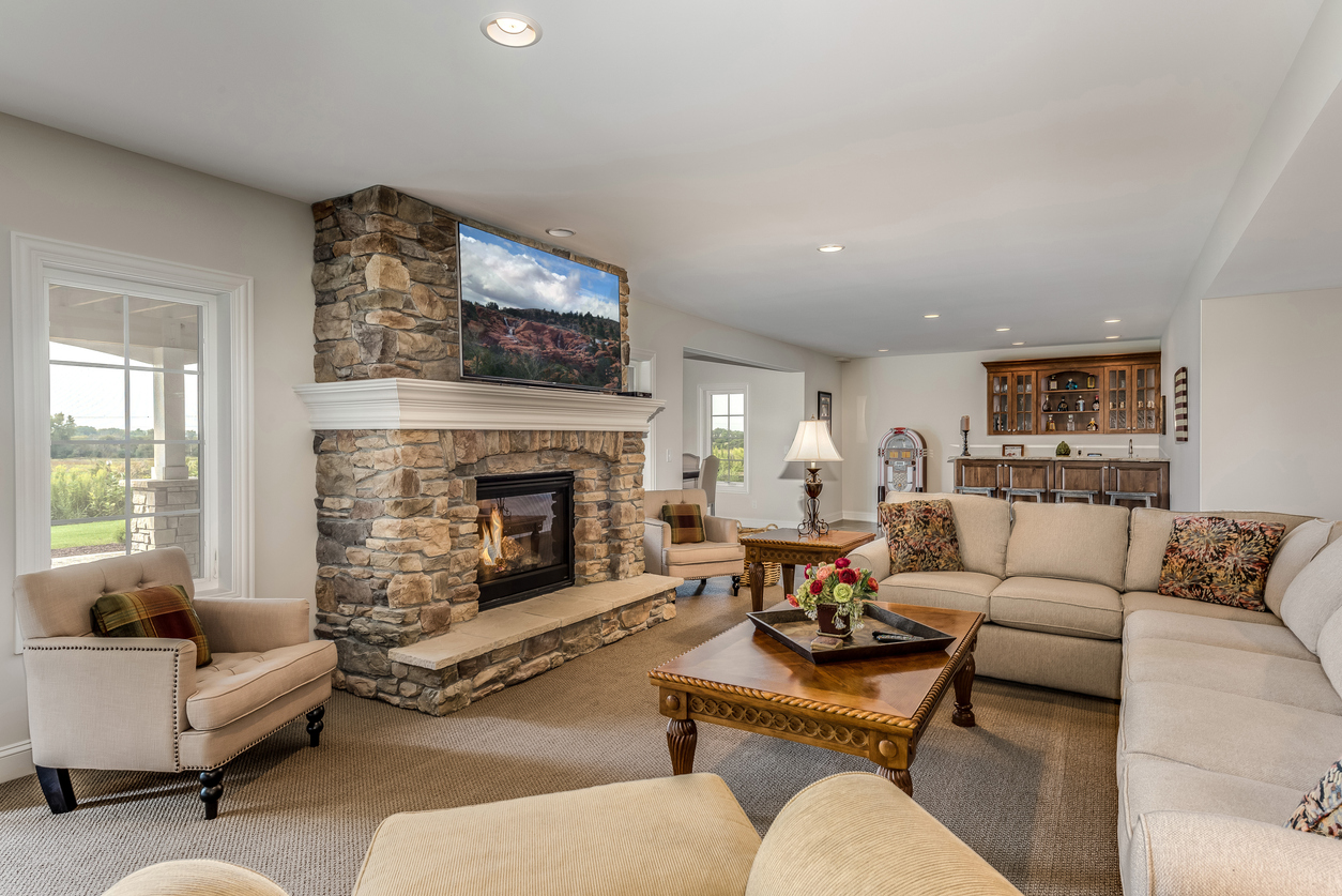a living room filled with furniture and a fire place