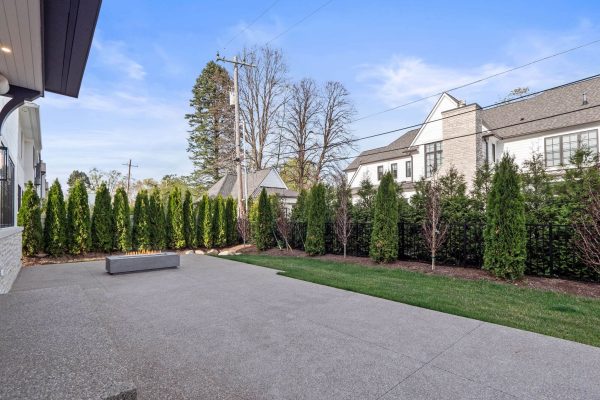 a path with trees on the side of a building