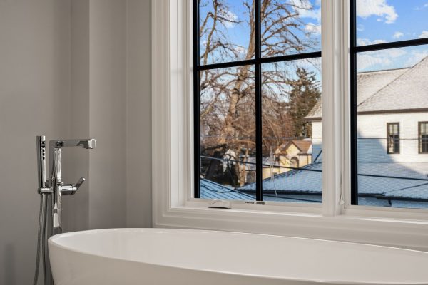 a close up of a sink and a window