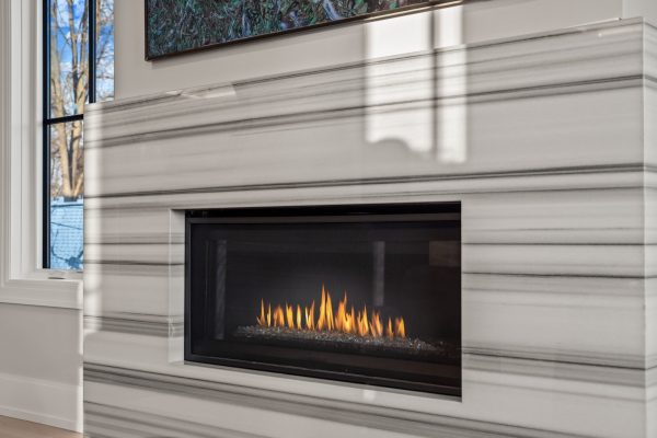 a fire place sitting in front of a window