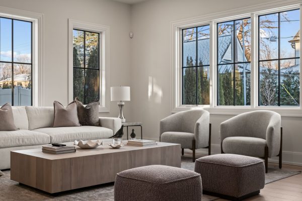 a living room filled with furniture and a large window