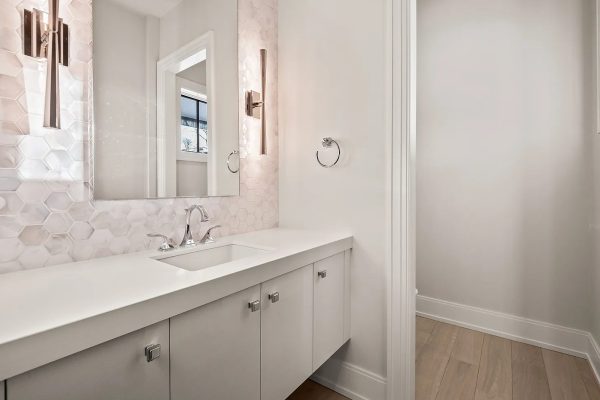 a room with a sink and a mirror