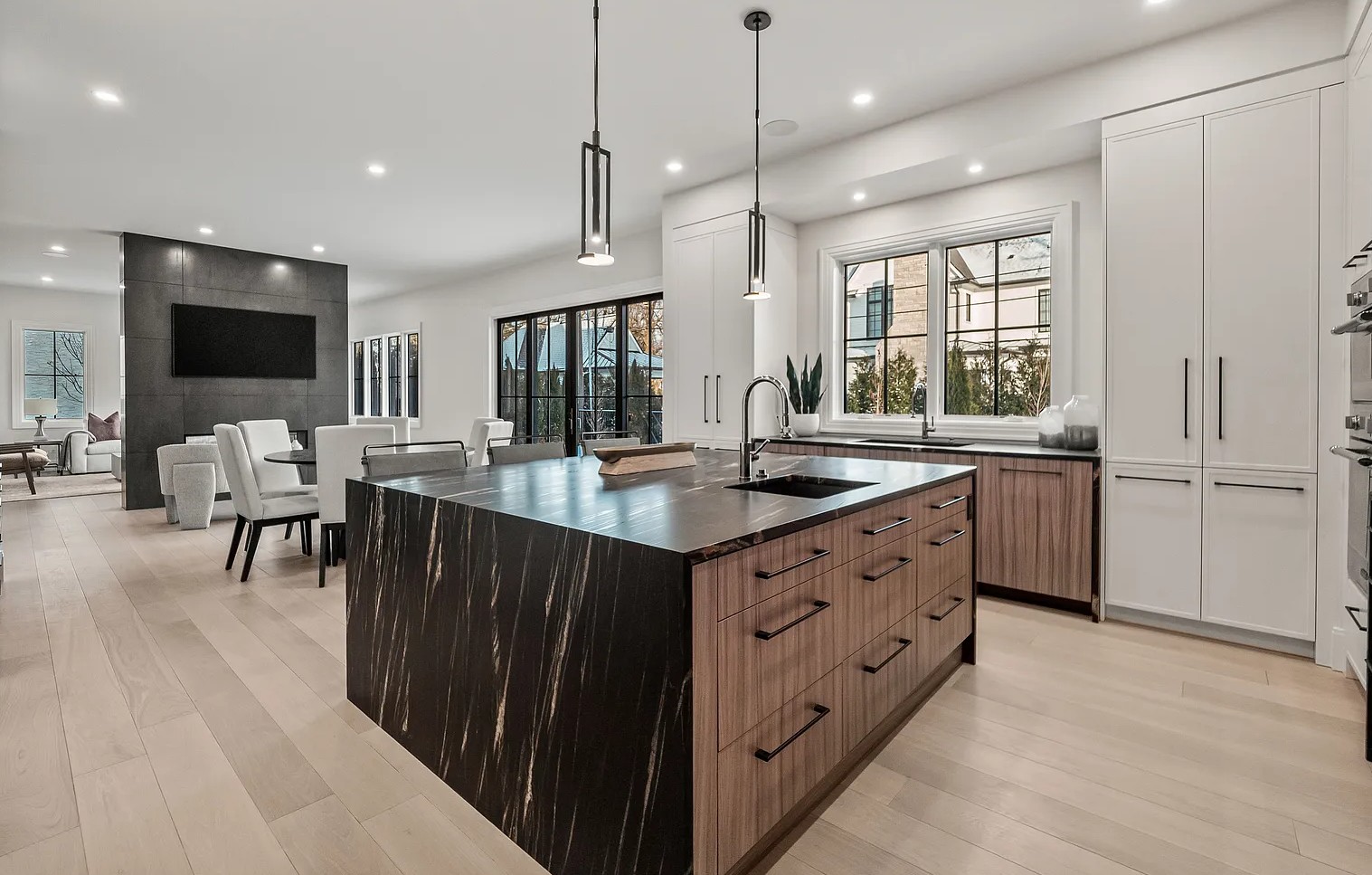 A kitchen remodel integrated with an open flow to the dining room and living room