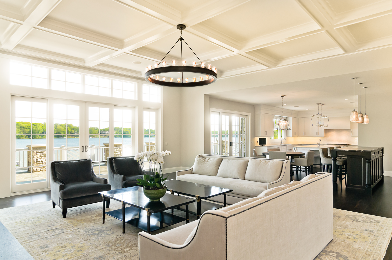 an open living room remodel with a custom coffered ceiling