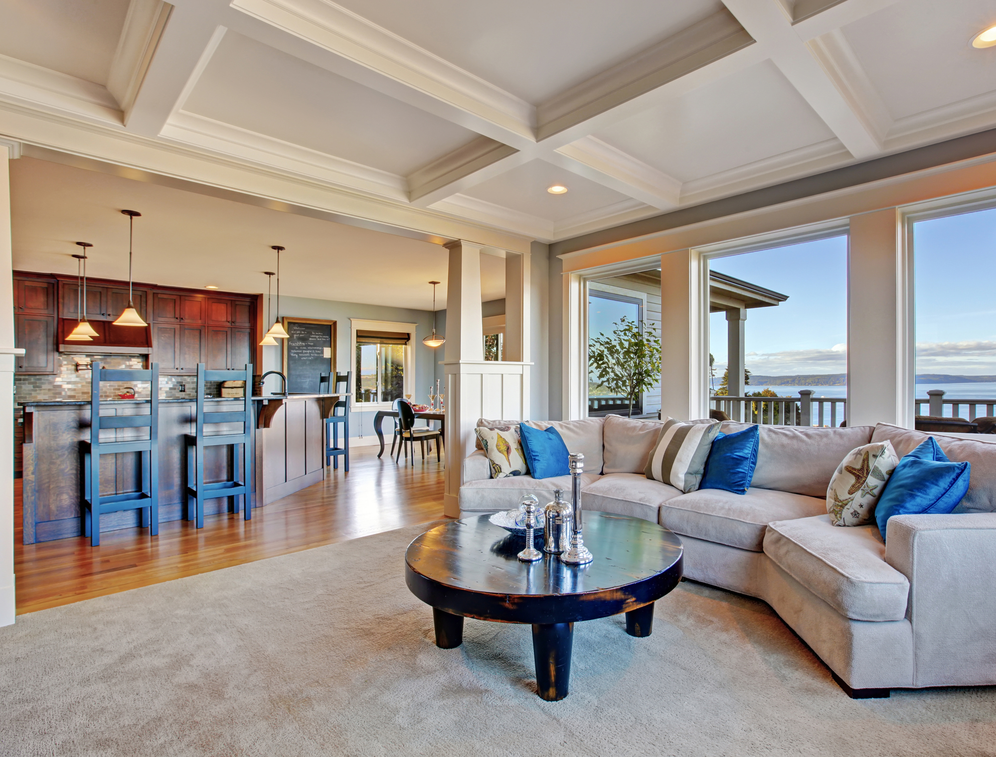 a luxury home remodeled with an open floor plan and coffered ceiling