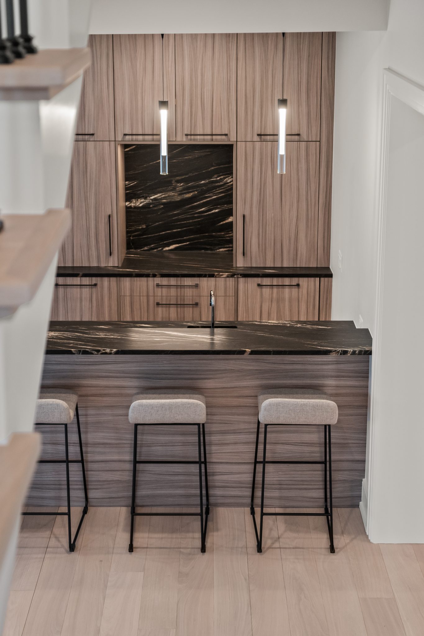 A remodeled kitchen with new countertops and cabinets.