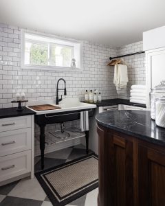 A wash station inside an expansive laundry room.